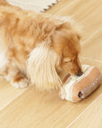 dog smells treat in Lambwolf Collective Eclair plush toy