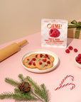 OHME! freeze-dried Raspberries packaging with cookies and raspberries on a pink surface