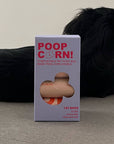 Box of Poop Corn compostable pet poop bags with a dog in the background