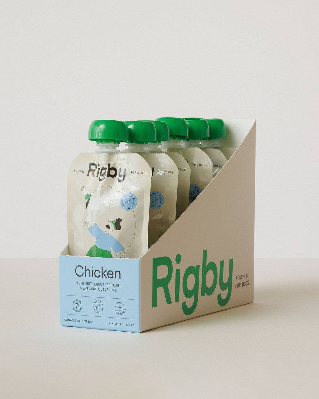 Packaging of Rigby chicken dog food pouches with a cardboard holder on a light background
