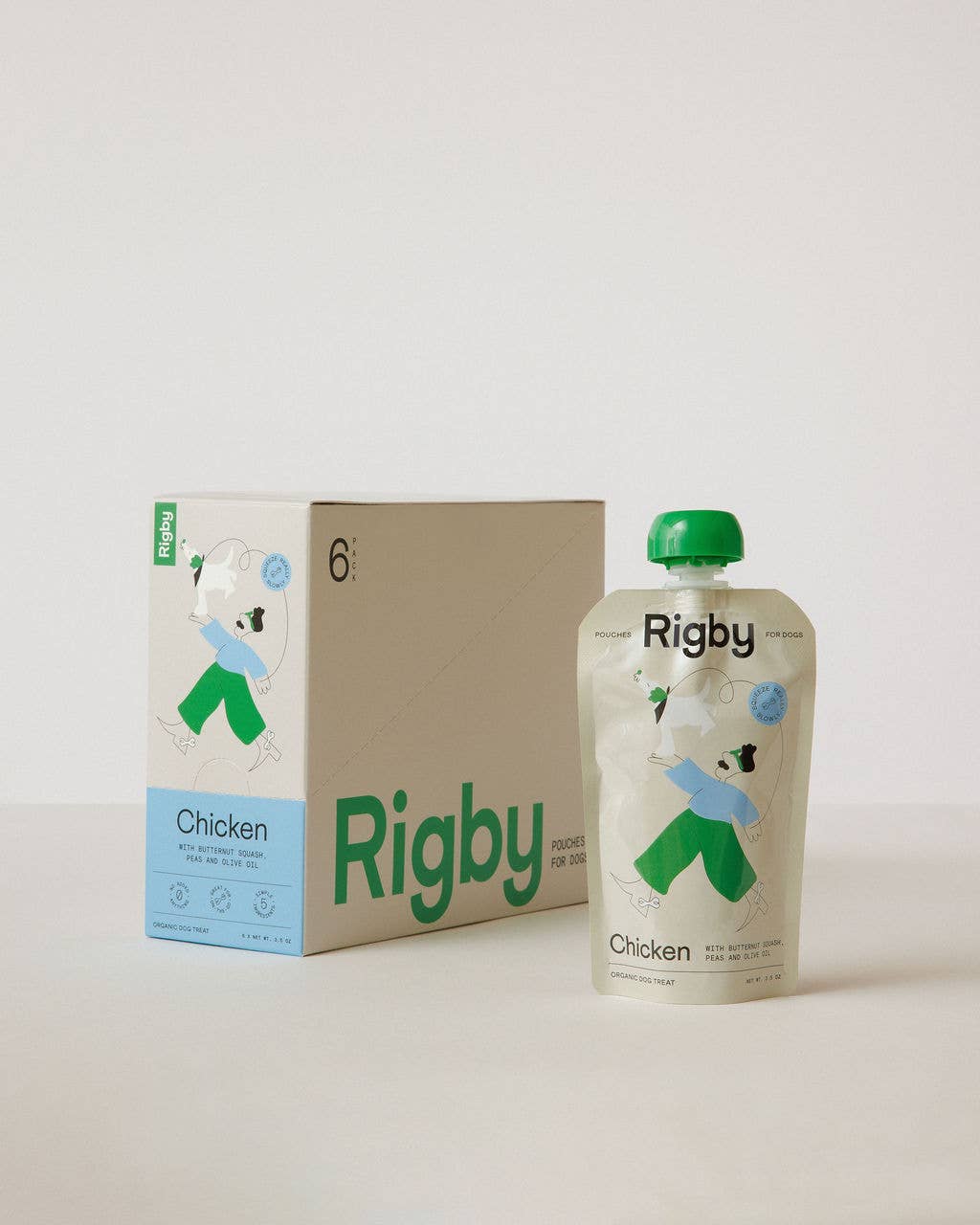 Rigby chicken dog food packaging including a box and a pouch on a light background