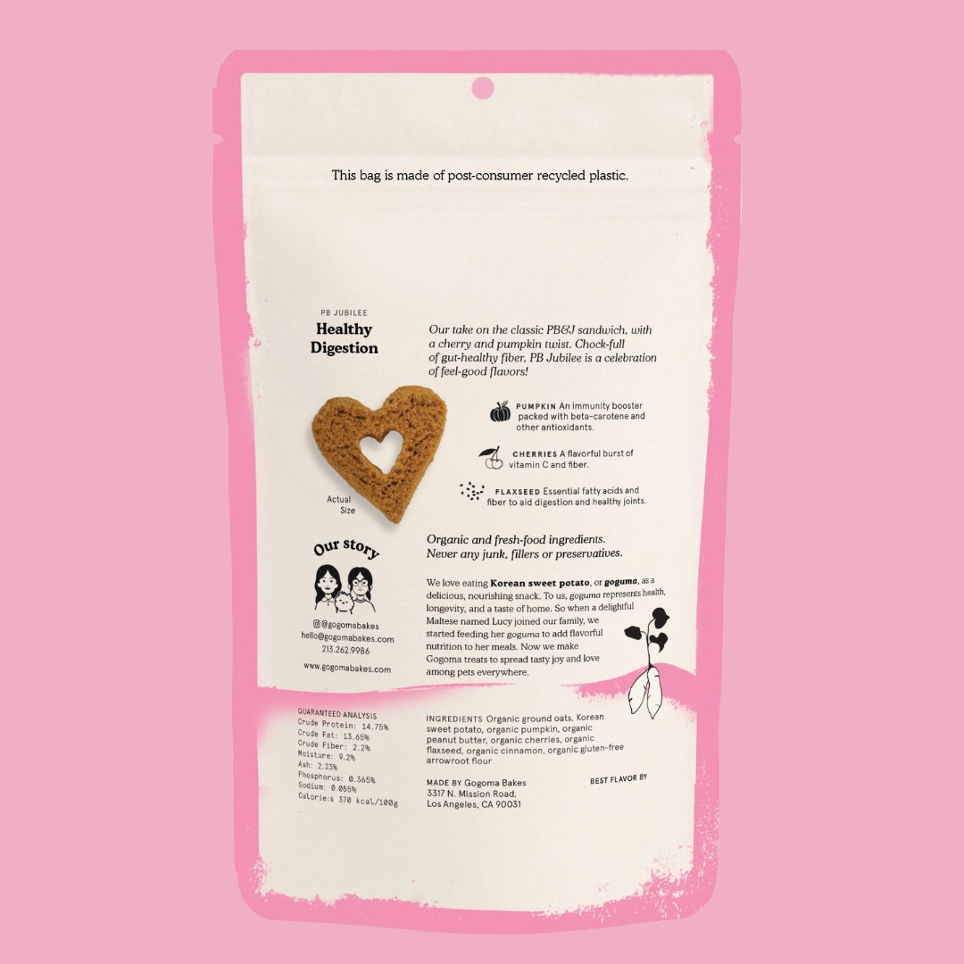 Dog treat package with heart-shaped cookie and text on a pink background